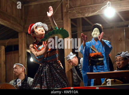 Tokorozawa, Japan. 1st Jan, 2018. At the stroke of midnight, hundreds of citizens descend on a local shrine to offer their first prayers of the New Year in Tokorozawa, Tokyos western suburbs on Monday, January 1, 2018. Throughout the country, millions of Japanese visit nearby shrines and temples, some offering the New Years first prayers while the other making first wishes in the centuries-old practice. Credit: Natsuki Sakai/AFLO/Alamy Live News Stock Photo