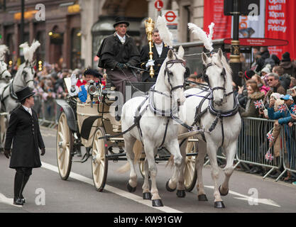 Central London, UK. 1st Jan, 2018. London's spectacular New Year's Day Parade starts at 12 noon in Piccadilly, making it's way down famous West End thoroughfares, finishing in Parliament Square at 3.00pm. Horse drawn landau with The Lord Mayor of The City of Westminster. Credit: Malcolm Park/Alamy Live News.