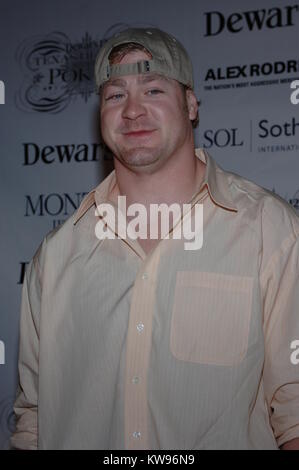 INDIAN CREEK,  FL. JANUARY 21: NY Giant Jeremy Shockey along with friends Jeremy Shockey, Joanna Krupa, Wayne Boich at the 2nd Annual Dewar's 12 Texas Hold 'em Poker Tournament. Hosted by Alex Rodriguez, Dewar's 12 and Boys & Girls Clubs of Miami.  January 21, 2006 in Indian Creek, Florida  People:  Jeremy Shockey Stock Photo