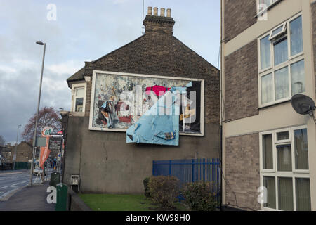 View of vacant billboard on side of terraced housing on Hoe Street, Walthamstow, London. Stock Photo