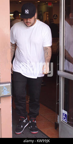 LOS ANGELES, CA - APRIL 26: Kim Kardashian, Rob Kardashian, and Fiancee Blac Chyna are seen heading for lunch on April 26, 2016 in Beverly Hills, California. .  People:  Rob Kardashian Stock Photo