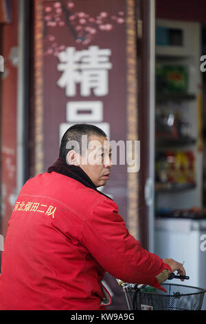 Zhangye,China - October 20,2017: Chinese man catches tickets at a box office on October 20, China. Stock Photo