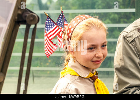 Little Scout girl with us flags in her hair, Celebrations of the liberated city, Plzen Czech Town, Pilsen liberation WW2 Czech Republic Stock Photo