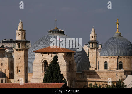 View of mosque minarets and dome of the Church of the Holy Sepulchre in the Christian Quarter. old city East Jerusalem Israel Stock Photo