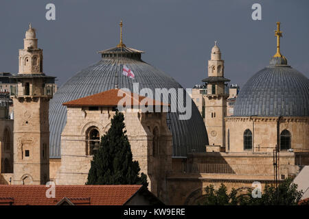 View of mosque minarets and dome of the Church of the Holy Sepulchre in the Christian Quarter. old city East Jerusalem Israel Stock Photo