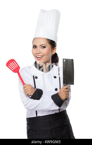 A young, female chef in a traditional hat and coat isolated on white background Stock Photo