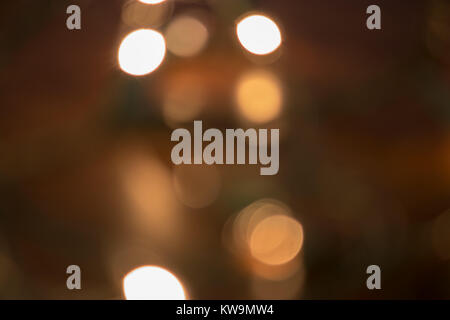 line of white bokeh on tree in dark Stock Photo