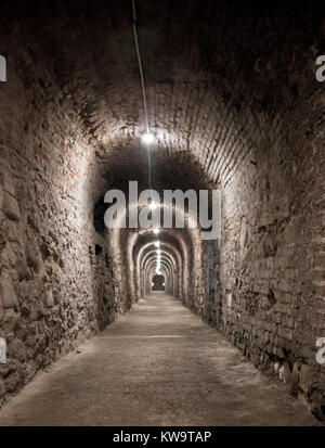 Long underground brick tunnel angle shot Stock Photo