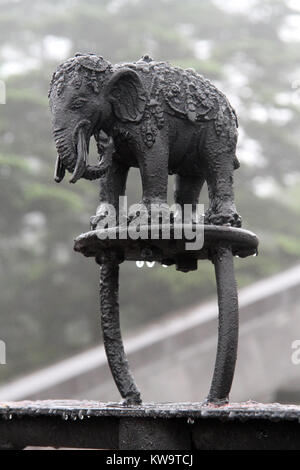Sculpture of wet black elephant on the buddhist shrine in temple Stock Photo