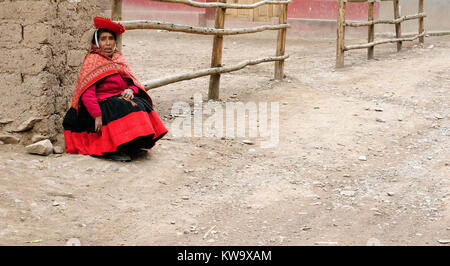 CUSCO, PERU - APRIL 05: Portrait of the woman from the Sacred Valley in the Cusco area waiting in the street for the transport to the market in South  Stock Photo