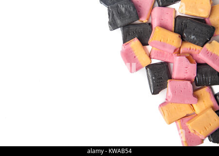 Fruit Salad and blackjack candy chews in a pile with copy space Stock Photo