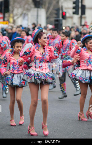 Central London, UK. 1st Jan, 2018. London's spectacular New Year's Day Parade starts at 12 noon in Piccadilly, making it's way down famous West End thoroughfares, finishing in Parliament Square at 3.00pm. Colourful south American costumes including Fraternidad Cultural Bolivia UK, Venezuela, Peru and Mexico. Credit: Malcolm Park/Alamy Live News.
