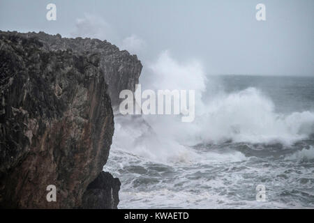 Llanes, Spain. 01st Jan, 2018. Waves crashing against the cliffs of 'Bufones of Pria' on January 01, 2018 in Llanes, Spain. 'Carmen' storm has arrived from the Atlantic to Spain bringing strong winds, rains and snowfalls to almost all the country. Asturias has registred gusts of winds reaching 100 km per hour. Credit: David Gato/Alamy Live News Stock Photo