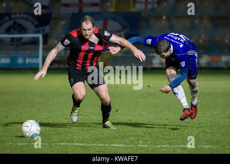 Halifax, UK. 01st Jan, 2018. George Waring (FC Halifax Town) pulls Keith Lowe's (Macclesfield Town) shirt while challenging for the ball and trying to retain his footing during FC Halifax Town v Macclesfield in the Vanarama National League game on Monday 1 January 2018 at The MBI Shay Stadium, Halifax, West Yorkshire. Photo by Mark P Doherty. Credit: Caught Light Photography Limited/Alamy Live News Stock Photo