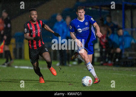 Halifax, UK. 01st Jan, 2018. Ben Tomlinson (FC Halifax Town) runs past Noe Baba (Macclesfield Town) during FC Halifax Town v Macclesfield in the Vanarama National League game on Monday 1 January 2018 at The MBI Shay Stadium, Halifax, West Yorkshire. Photo by Mark P Doherty. Credit: Caught Light Photography Limited/Alamy Live News Stock Photo