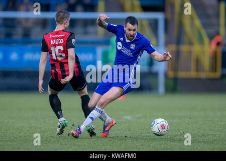 Halifax, UK. 01st Jan, 2018. Michael Collins (FC Halifax Town) controls the ball and wrong foots Mitch Hancox (Macclesfield Town) during FC Halifax Town v Macclesfield in the Vanarama National League game on Monday 1 January 2018 at The MBI Shay Stadium, Halifax, West Yorkshire. Photo by Mark P Doherty. Credit: Caught Light Photography Limited/Alamy Live News Stock Photo