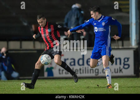 Halifax, UK. 01st Jan, 2018. David Fitzpatrick (Macclesfield Town) controls the ball under pressure from Josh MacDonald (FC Halifax Town) during FC Halifax Town v Macclesfield in the Vanarama National League game on Monday 1 January 2018 at The MBI Shay Stadium, Halifax, West Yorkshire. Photo by Mark P Doherty. Credit: Caught Light Photography Limited/Alamy Live News Stock Photo