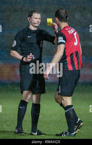 Halifax, UK. 01st Jan, 2018. Caution: Referee Peter Wright shows a yellow card to David Fitzpatrick (Macclesfield Town) during FC Halifax Town v Macclesfield in the Vanarama National League game on Monday 1 January 2018 at The MBI Shay Stadium, Halifax, West Yorkshire. Photo by Mark P Doherty. Credit: Caught Light Photography Limited/Alamy Live News Stock Photo