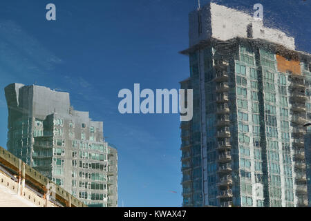 Abstract artistic impressions with building reflections in the water at Coal Harbour Marina, Vancouver waterfront Stock Photo