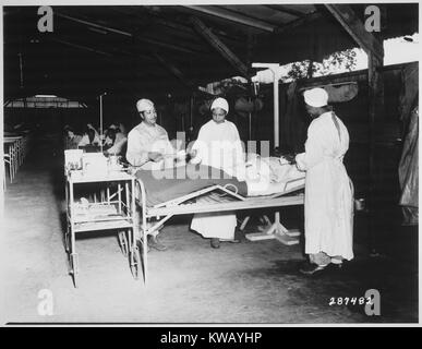 Surgical ward treatment at the 268th Station Hospital Base A in Milne Bay, New Guinea, June 22, 1944. Image courtesy National Archives. Stock Photo