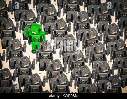concept gong against the crowed with retro robot toys Stock Photo