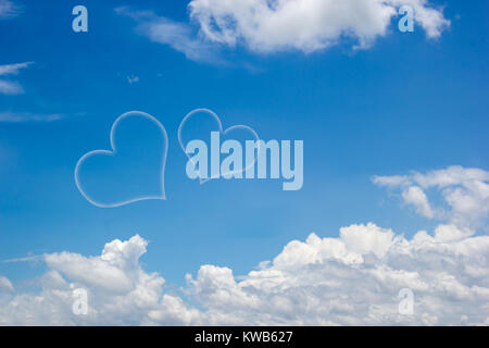 Heart shape clouds on blue sky background with copy space. Valentine day concept idea. Stock Photo