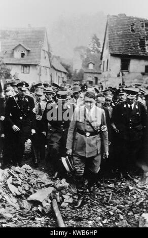 Adolf Hitler, with German military and officials, inspects bomb damage in a German city in 1944. World War 2. (BSLOC 2014 8 167) Stock Photo
