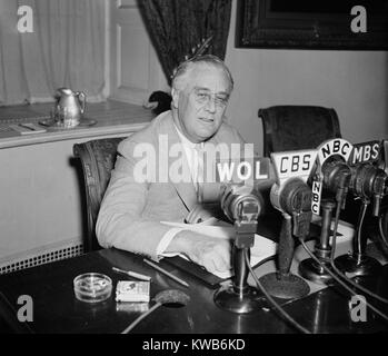 President Roosevelt broadcasting a 'Fireside Chat' on May 26, 1940. He spoke of the World situation as Nazi armies advanced through Western Europe and of U.S. defense plans. He attacked isolationists, as 'the Trojan Horse and the Fifth Column that betrays a nation unprepared for treachery'. World War 2. (BSLOC 2014 8 186) Stock Photo
