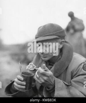 Ernie Pyle, war correspondent, eating his 'C' rations. First Army, Anzio Beachhead, Italy, March 18, 1944. (BSLOC 2014 8 218) Stock Photo