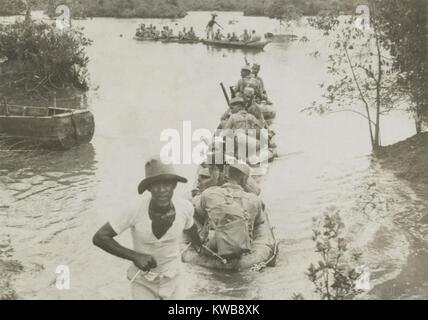 British Indian Army crossing a river in collapsible rubber boats in Singapore, Malaya. Ca. Nov.-Dec. 1941. World War 2. (BSLOC 2014 10 147) Stock Photo