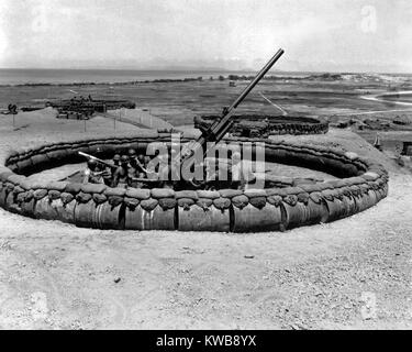 90mm anti-aircraft gun emplacement with crew in pit on Okinawa, July 18, 1945. World War 2. (BSLOC 2014 10 155) Stock Photo