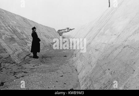 German soldier in an anti-tank ditch on the Atlantic Wall north of Caen, France. 1944. World War 2. (BSLOC 2014 10 72) Stock Photo
