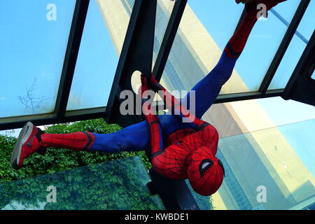 Spider-Man performing at the CN Tower pedestrian walkway, Toronto, Ontario, Canada Stock Photo
