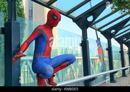 Spider-Man performing at the CN Tower pedestrian walkway, Toronto, Ontario, Canada Stock Photo