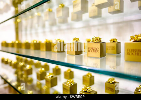 Store shelf displaying gift wrapped boxes of Ferrero Rocher chocolate during Christmas season at Yorkdale Shopping Centre, Toronto, Ontario, Canada. Stock Photo