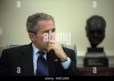 President George W. Bush during a meeting in the Oval Office of the White House. Oct. 10, 2001. In the background is a bust of Winston Churchill. Operation Enduring Freedom combat in Afghanistan started three days earlier on October 7, 2001. (BSLOC 2015 2 173) Stock Photo