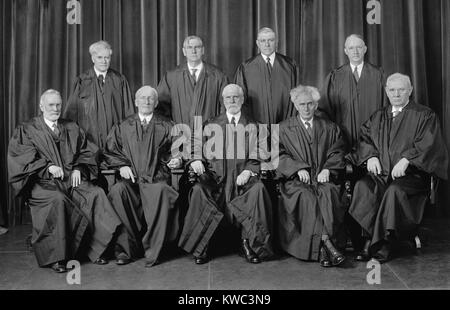 The Justices of the Supreme Court, 1937-38. Sitting, from left to right, Justices George Sutherland, James McReynolds, Chief Justice Charles Evans Hughes, Justices Louis Brandeis and Pierce Butler. Standing, left to right, Justices Benjamin Cardozo, Harlan Stone, Owen Roberts, and Hugo Black. (BSLOC 2015 14 15) Stock Photo