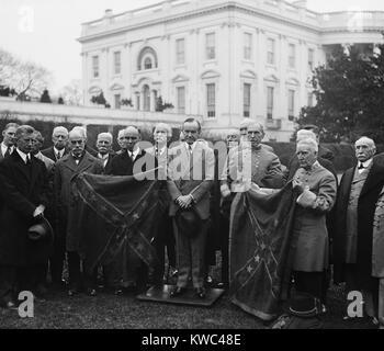 President Calvin Coolidge with Confederate group holding 'Star and Bars' flag. White House, Dec. 1927. (BSLOC 2015 15 128) Stock Photo