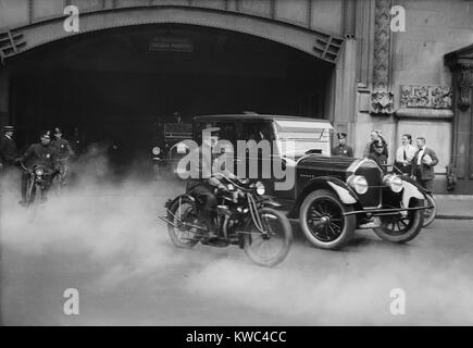 President Calvin Coolidge's car escorted by motorcycle police in New York City. The President and First Lady Grace Coolidge can be seen inside the car. Ca. 1923-29. (BSLOC 2015 15 173) Stock Photo