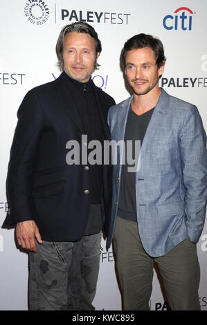 NEW YORK, NY - OCTOBER 18: Mads Mikkelsen, Hugh Dancy attends the 2nd Annual Paleyfest New York Presents: 'Hannibal' at Paley Center For Media on October 18, 2014 in New York, New York  People:  Mads Mikkelsen, Hugh Dancy Stock Photo