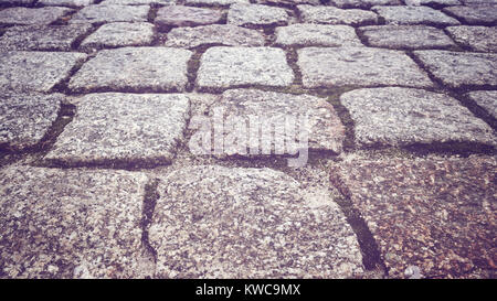 Cobblestone path in a park, close up color toned picture, shallow depth of field. Stock Photo