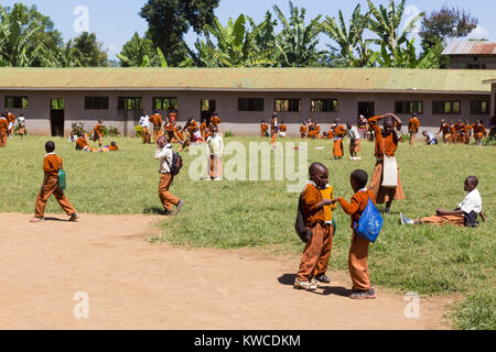 Children in uniforms playing in the cortyard of primary school in rural area near Arusha, Tanzania, Africa. Stock Photo