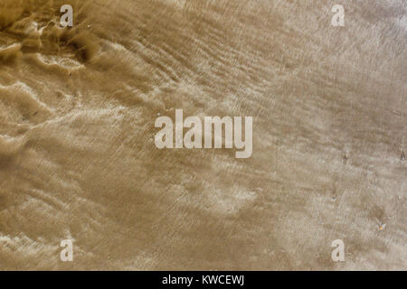 Background, sand on the beach after the departure of the wave. Stock Photo