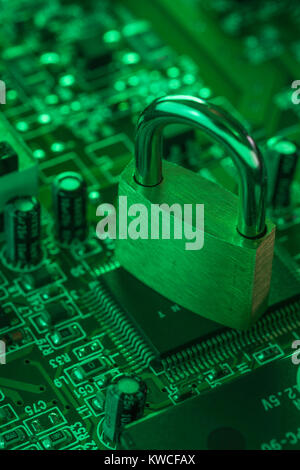 Padlock resting on a circuit-board. For concept of secure data, email security, antivirus software, data protection, secure payments, cyber threat. Stock Photo