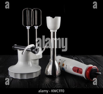 Electric hand blender, isolated on a black background. Stock Photo