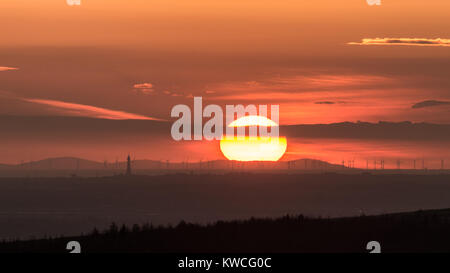 Sunset over the Isle of Man with a distant Blackpool in the foreground Stock Photo