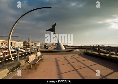 Steel artwork shaped like a tail fin on Blackpool Promenade Stock Photo