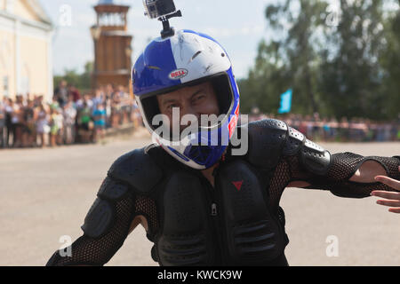 Verkhovazhye, Vologda region, Russia - August 10, 2013: Alexei Kalinin begins motorcycle show in the village Verkhovazhye and welcomes the audience by Stock Photo