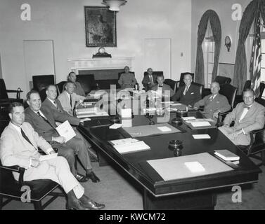 President Harry Truman with National Security Council, Aug. 19, 1948. Established in 1947, its members were from civilian, military, and intelligence agencies. L-R: Around the table: Cornelius Vanderbilt Whitney; Army Kenneth Royall; Exe. Sec. NSC, Sidney Souers; Arthur Hill; Dir. CIA, Roscoe Hillenkoetter; James Forrestal; George Marshall; Truman; W. John Kenney. In back: Gen. A. M. Gruenther, Dir. Joint Chiefs of Staff (left); and Robert Blum. - (BSLOC 2014 14 25) Stock Photo