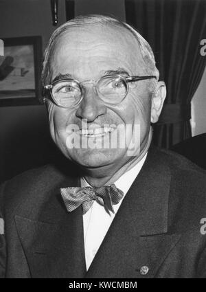 Harry Truman starting his 6th year as U.S. President with a smile. Photo taken at Truman's White House office on April 12, 1950. - (BSLOC 2014 15 12) Stock Photo